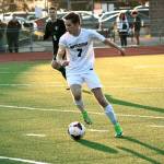 Senior forward Grant Larson dribbles through the Emerald Ridge defense on Senior Night.                                 Mark Krulish |                                 Kitsap News Group