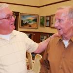 Friends Roy Carr (left) and Bob Ulsh reminisced about their shared history as painters in the South Kitsap area. (Bob Smith | Kitsap Daily News photo 2016)