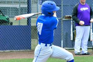 Trojans senior catcher Kylen Pereira hammers a pitch in a game against North Kitsap on March 21. The Vikings won 3-2. Mark Krulish | Kitsap Daily News