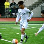 Darius Joe attempts to dribble through the Coupeville defense during a 3-0 win on May 10. (Mark Krulish/Kitsap News Group)