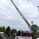 This could qualify as a fold-out photo of the month for a 9-year-old youngster  a South Kitsap Fire and Rescue ladder truck reaching to the sky. Apparatus and equipment from the fire department, as well as from Port Orchard Police, Washington State Patrol and Kitsap County Sheriffs Office, were on hand to see and touch at the Safety Fair and Bicycle Rodeo May 19 in Port Orchard. (Bob Smith | Kitsap Daily News)