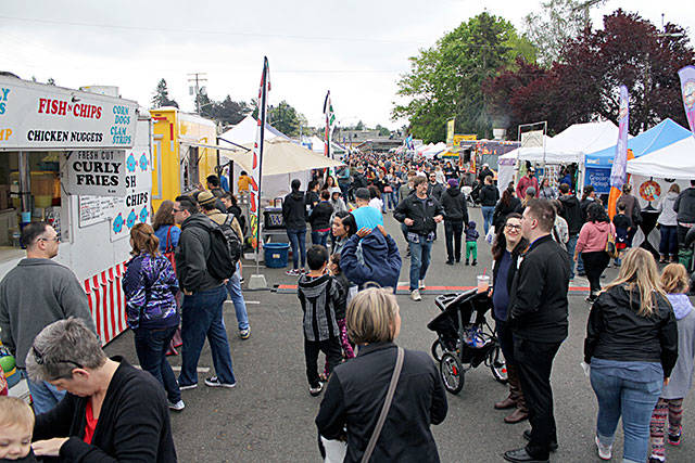 Vendors and nonprofits set up stalls along Anderson Parkway to sell their goods and generate awareness for their causes. Nick Twietmeyer / Kitsap News Group