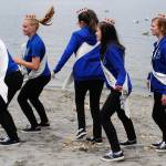 Junior Princess Danyelle Wilcox (second from left) takes a hair-flipping hop with members of the Fathoms O Fun Royalty Court at the Seagull Calling Contest May 26. (Bob Smith | Kitsap Daily News photo)