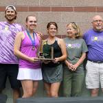 North Kitsaps Danya Wallis became the first Kitsap tennis player to win four state championships. Here she shares North Kitsaps team title with teammate Anna Bronchal and head coach Jordan Prince. (Jacob Moore/Kitsap News Group)