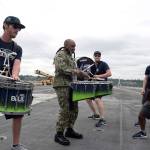 <em>Cmdr. Rodney Moss, from Concord, North Carolina, and the Seattle Seahawks drumline, Blue Thunder, perform aboard the aircraft carrier USS John C. Stennis (CVN 74).</em>                                Mass Communications Specialist Seaman Angelina Grimsley / U.S. Navy