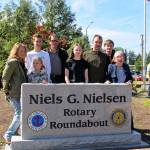 Members of the Nielsen family stand behind the newly installed Niels G. Nielsen granite monument at the Bethel Avenue-Mile Hill Drive roundabout. (Nielsen family photo)