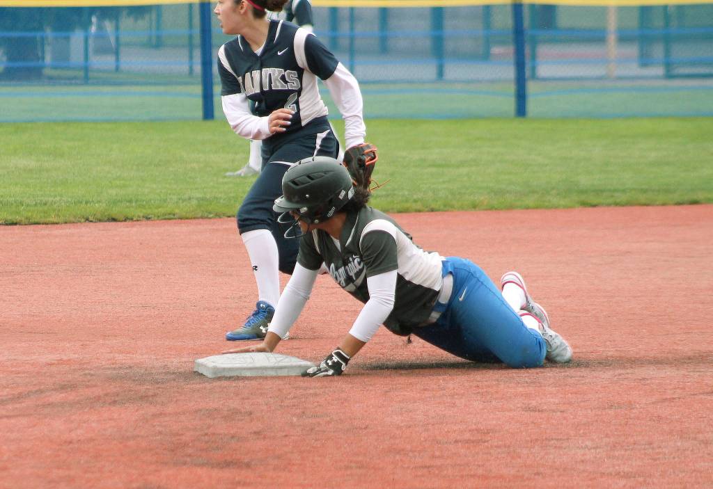 <em>Olympic shortstop Kiki Mitchell slides into second during a district tournament game.</em>                                Mark Krulish / Kitsap News Group