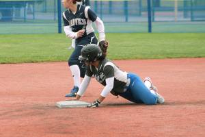 <em>Olympic shortstop Kiki Mitchell slides into second during a district tournament game.</em>                                Mark Krulish / Kitsap News Group