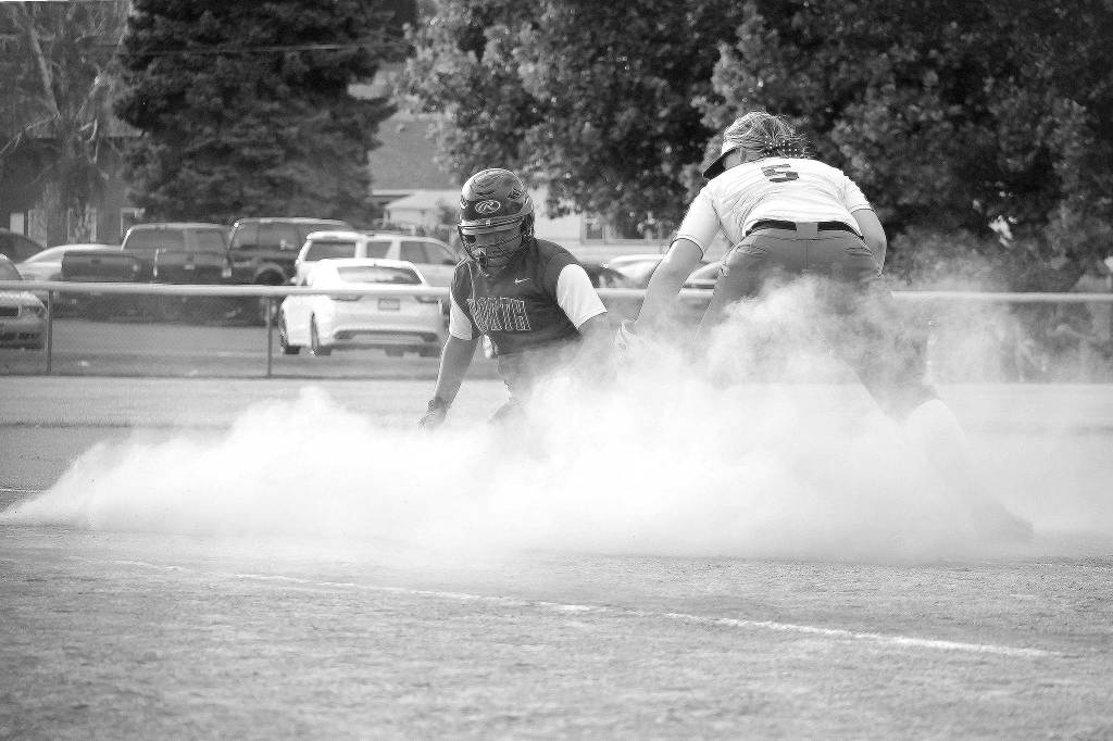 <em>Alicia Goetz slides safely into third during the state tournament. The junior second baseman is one of five North Kitsap players named to an All-League team. </em>Mark Krulish / Kitsap News Group