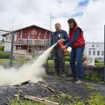 Craig Brown, administrative officer with U.S. Power Squadrons District 16 instructs a participant in the proper use of a fire extinguisher during the Boating Safety Day event in Poulsbo on June 9. Courtesy Steve Erickson.
