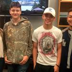Lily Moon (second from left), James Marasco, Devin Gentz and Marcello Parrott, who are graduating students from South Kitsap High School, applied and were hired in the radiological monitoring division at Puget Sound Naval Shipyard. Dave Reichel, a career counselor at the high school, stands at far left in the photo. (South Kitsap School District photo)