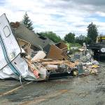 <em>A trailer that had just been purchased in Poulsbo by an Auburn woman and her male passenger flips over on State Route 3 near Trigger Ave. in Silverdale.</em> Photo courtesy of Washington State Patrol Trooper Chelsea Hodgson