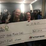 Home Made Cafes co-owner/operators Paul Robinson and Suanne Martin-Smith accept the $20,000 ceremonial grand prize check from Kitsap Bank after being named the winner of the edg3 FUND small-business competition in November 2017. (file photo 2017)