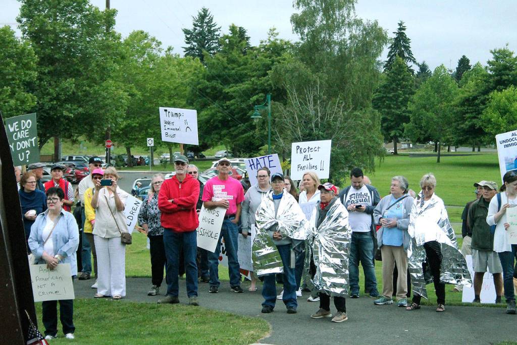 Hundreds gather in Bremerton’s Evergreen Park to protest family separations