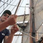 A crew member of Hawaiian Chieftain takes command of a mast line. (Bob Smith | Kitsap Daily News photo)