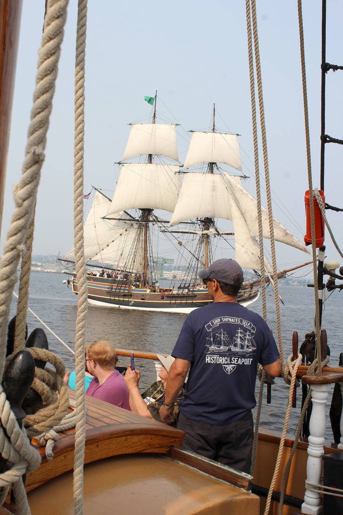 Tall ship Lady Washington sails within cannon fire of Hawaiian Chieftain on Sinclair Inlet. (Bob Smith | Kitsap Daily News photo)