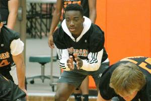 Central Kitsap senior Elijah McGee takes snaps at quarterback during a pre-season indoor practice. McGee was one of the teams top running backs last year. (Mark Krulish/Kitsap News Group)