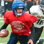 Bremerton quarterback Kelo Logova escapes the pocket during a scrimmage against Central Kitsap. (Mark Krulish/Kitsap News Group)