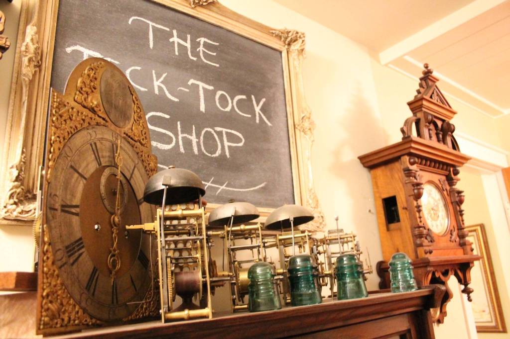 Peases home workshop showcases the numerous movements, removed from their cases and displayed on a shelf. Nick Twietmeyer | Kitsap News Group.