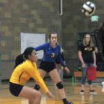 Bremertons Patricia Reyes digs out a spike while teammate Jennifer Kielley looks on. (Mark Krulish/Kitsap News Group)