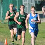 Klahowyas Jaeden Ellis (left) and Alex Oathout (middle) chase North Masons Noah Hasselblad. (Mark Krulish/Kitsap News Group)