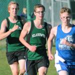 Klahowyas Jaeden Ellis (left) and Alex Oathout (middle) chase North Masons Noah Hasselblad. (Mark Krulish/Kitsap News Group)