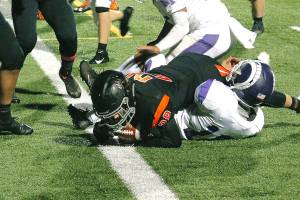 Central Kitsaps Joshua Willis crashes into the end zone against North Thurston. (Mark Krulish/Kitsap News Group)