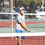 Zachary Wyant returns serve for Olympic High School at the league tennis championships. (Mark Krulish/Kitsap News Group)