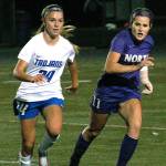 North Kitsaps Jamison Jacobson tries to slip past Olympics Hanna Troy in an Oct. 18 match. (Mark Krulish/Kitsap News Group)