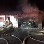 South Kitsap Fire and Rescue crews extinguish a late-night house fire in the Manchester area. (SKFR photo)