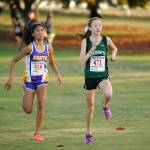 North Kitsaps Madison Zosa and Klahowyas Rachel Newhard pump hard towards the finish line. Zosa finished second, Newhard finished third. (Michael Dashiell/Sequim Gazette)