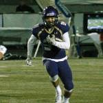 Clayton Williams rushes to the edge during his teams 60-19 win over Olympic. (Mark Krulish/Kitsap News Group)