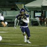 Clayton Williams rushes to the edge during his teams 60-19 win over Olympic. (Mark Krulish/Kitsap News Group)