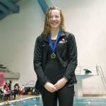 Isabel Hendryx receives her medal for winning the 100-yard backstroke. (Mark Krulish/Kitsap News Group)