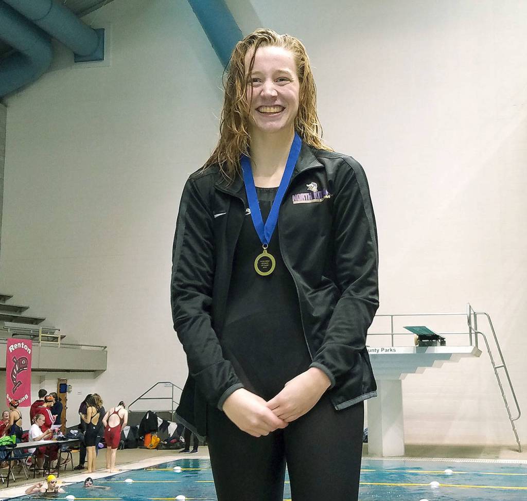 Isabel Hendryx receives her medal for winning the 100-yard backstroke. (Mark Krulish/Kitsap News Group)