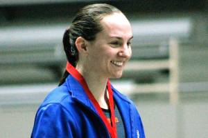Chloe Partsch receives her medal for winning the 200-yard individual medley. She is the first state champion in Olympic girls swimming history. (Mark Krulish/Kitsap News Group)