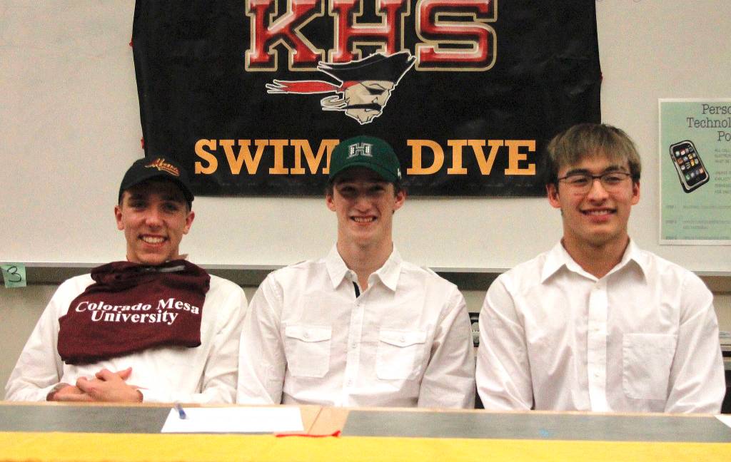 Kingston seniors Ethan Fox, Tim Gallagher and Aron Markow have signed their letters of intent to swim at Colorado Mesa University, University of Hawaii and University of Wyoming respectively. (Mark Krulish/Kitsap News Group)