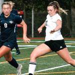 Kayden Eckley tries to slip by the Knights defense during her teams 1A state semifinal game. (Mark Krulish/Kitsap News Group)