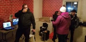 Scott Power of the Olympic Peninsula Paranormal Society, orchestrates the rotation of visitors in the Walker-Ames house during a paranormal investigation.