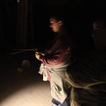 Sheila Pickering holds two dousing rods in the attic of the Walker-Ames house. Nick Twietmeyer | Kitsap News Group.