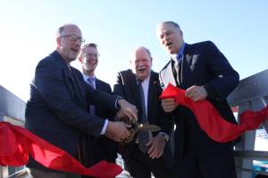 <em>Rob Gelder, Derek Kilmer, John Clauson and Gov. Jay Inslee cut the ribbon on the walkway to M/V Finests moorage at the Port of Kingston. </em>Nick Twietmeyer/Kitsap News Group