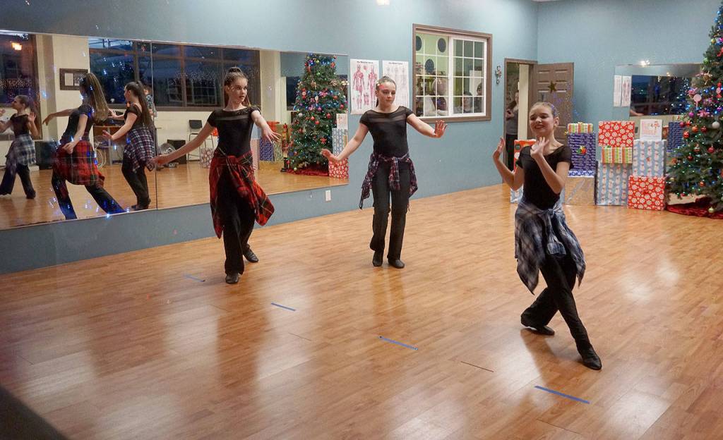 Young dancers perform for onlookers outside The Dance Gallery on Bay Street during the Festival of Chimes and Lights Saturday, Dec. 1. (Bob Smith | Kitsap Daily News)