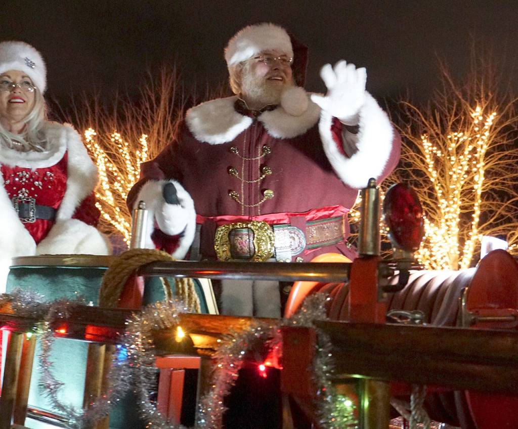 Santa Claus, accompanied by Mrs. Santa, closes out the annual Festival of Chimes and Lights celebration in downtown Port Orchard. (Bob Smith | Kitsap Daily News)