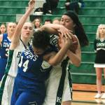 Eagles center Kayla Hendricks and Chimacums Diamond Young (14) battle for a rebound. (Mark Krulish/Kitsap News Group)
