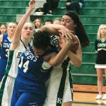 Eagles center Kayla Hendricks and Chimacums Diamond Young (14) battle for a rebound. (Mark Krulish/Kitsap News Group)
