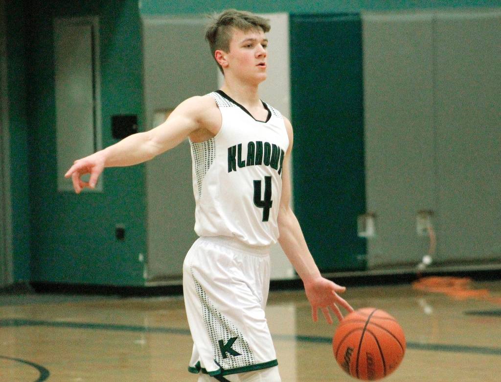 Klahowya guard Gabriel Smith sets up the offense during his teams league victory over Chimacum. (Mark Krulish/Kitsap News Group)