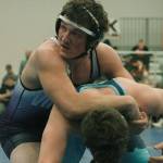 Cache Holmes of North Kitsap takes on Simon Atwell of Gig Harbor. (Mark Krulish/Kitsap News Group)