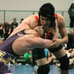 Kingstons David Jensen squares off with Carter Murphey of Hanford in the 152-pound division. (Mark Krulish/Kitsap News Group)