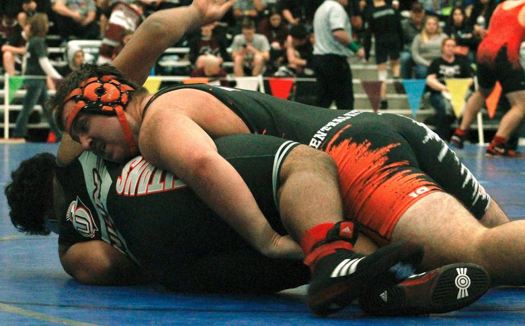 Central Kitsap wrestler Nate Larson defeats Tumua Sosense of Union by pin in 1:58 in a second round matchup. (Mark Krulish/Kitsap News Group)