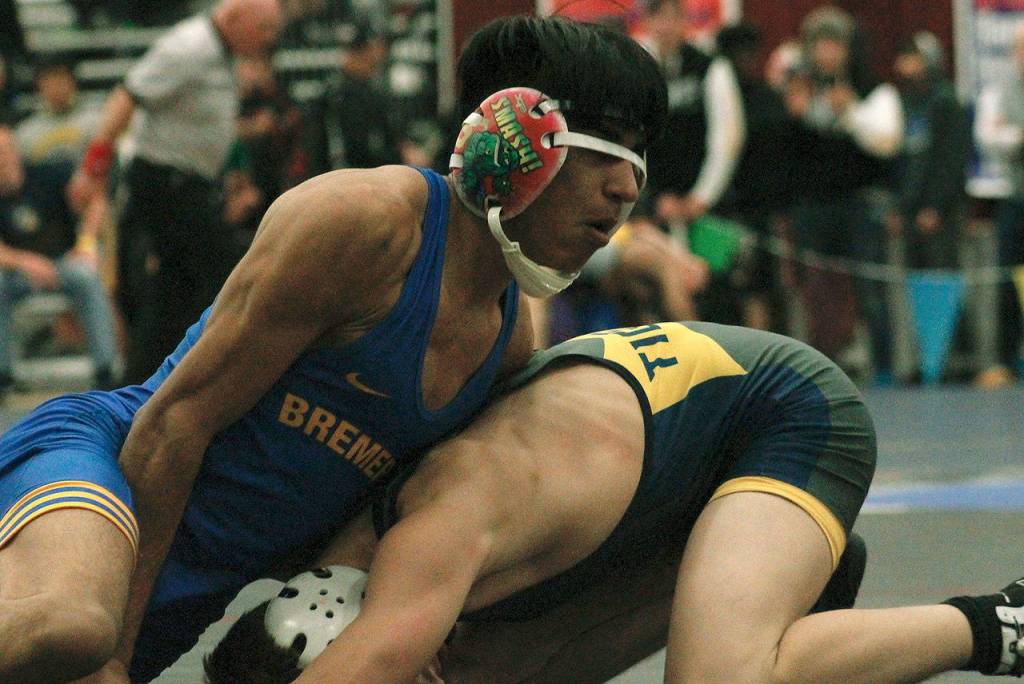 Bremertons Estan Wakonabo takes down Davis Cook of Burlington-Edison. (Mark Krulish/Kitsap News Group)